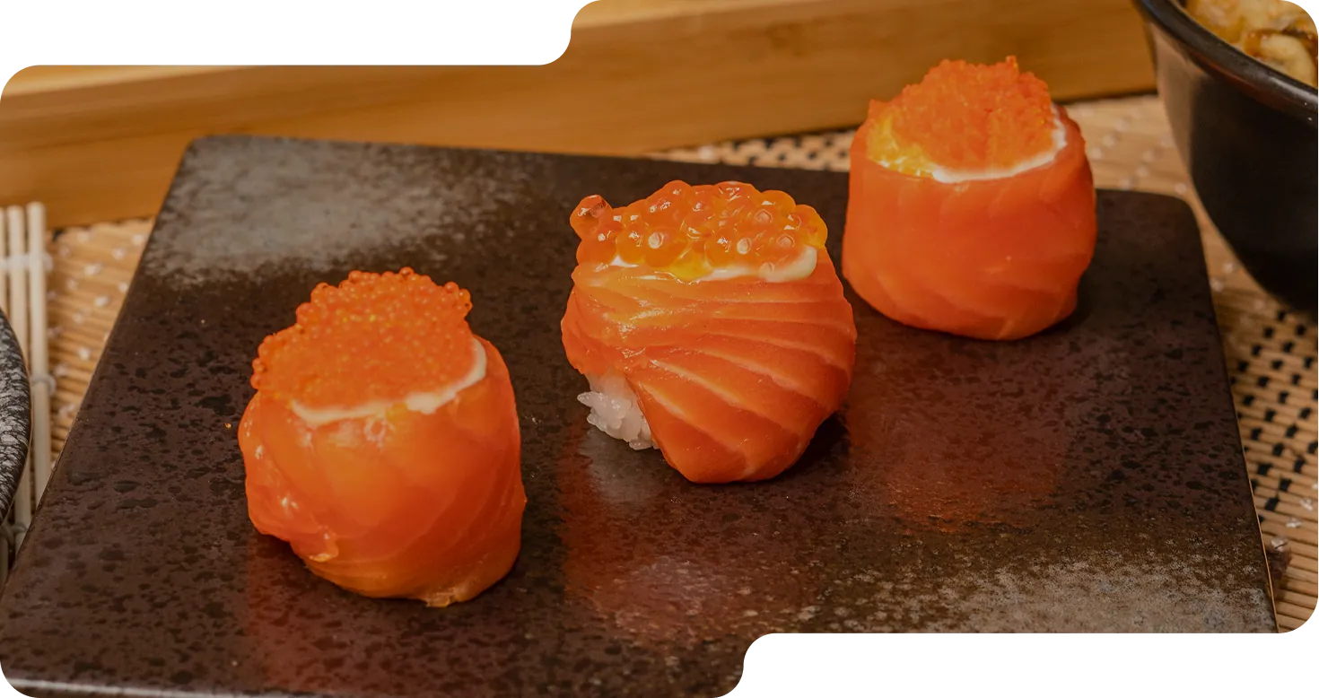 Salmon ikura gunkan on a slate plate