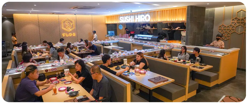 Warm, busy Sushi Hiro dining room