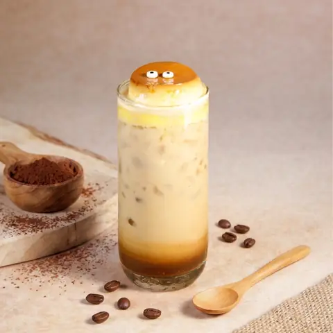 Tiramisu Latte — Dark roasted coffee and fresh milk crowned with vanilla purin