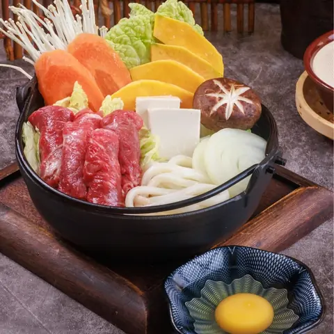 Sukiyaki — Japanese hot pot with sliced Aussie beef, tofu, vegetables, egg and udon