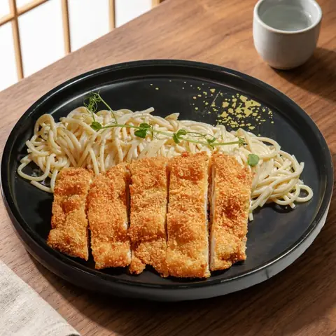 Tori Katsu Cream Pasta — Pasta in cream sauce topped with crispy breaded chicken