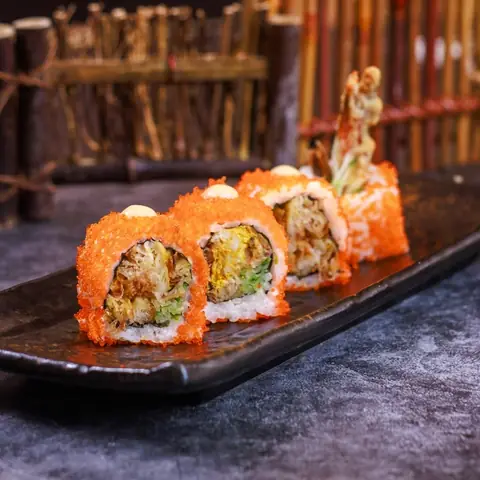 Spider Maki — Fried soft shell crab topped with shrimp roe