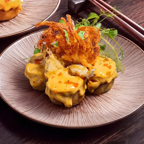 Volcano Spider Maki — Crispy soft shell crab, torched with house cheese sauce