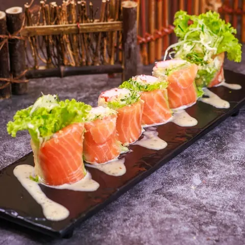 Salmon Salad Roll — Salmon, crabstick, carrot, cucumber and tempura crumbs with house sesame dressing