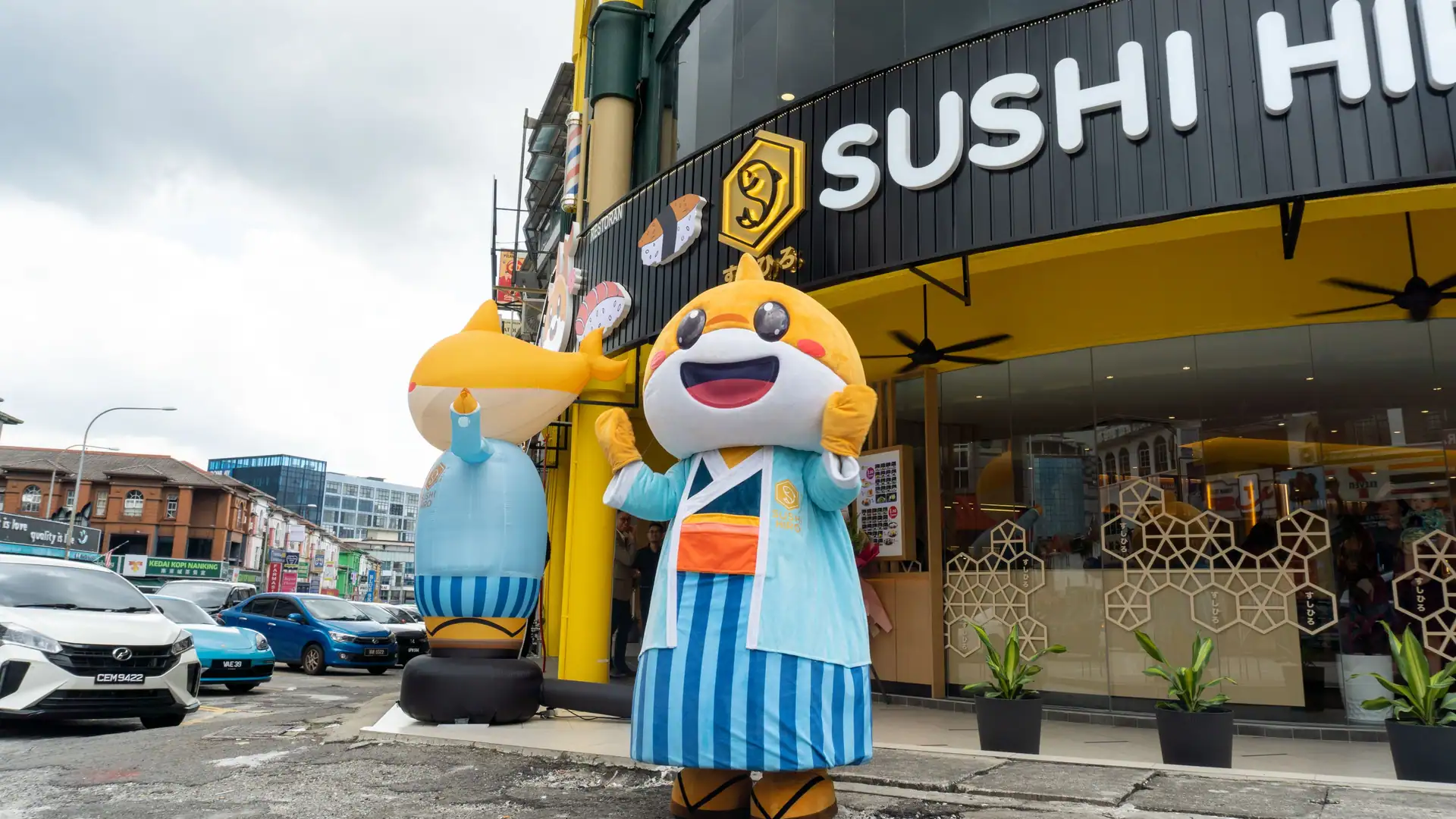 Hiro Boy greeting guests outside a Sushi Hiro outlet