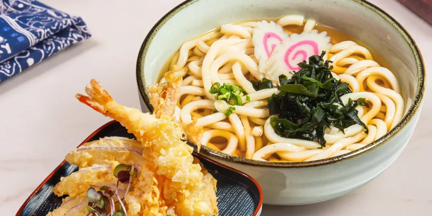 Tempura udon in dashi broth with golden prawn tempura
