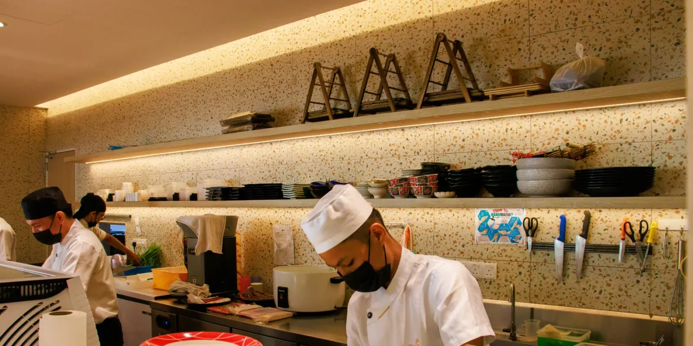 A Sushi Hiro chef preparing sushi in the kitchen
